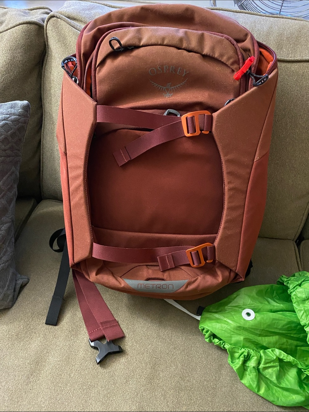 OSPREY Rust Red Backpack with Bright Green Rain Cover